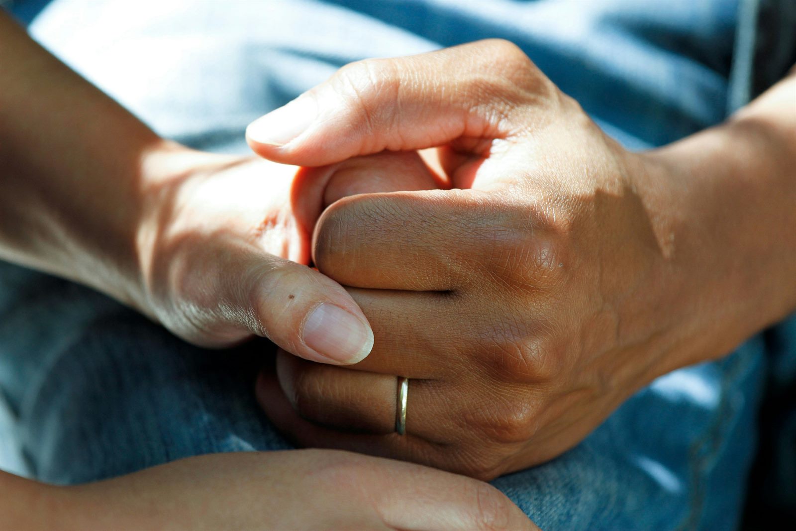 Senior person exercising with caregiver support