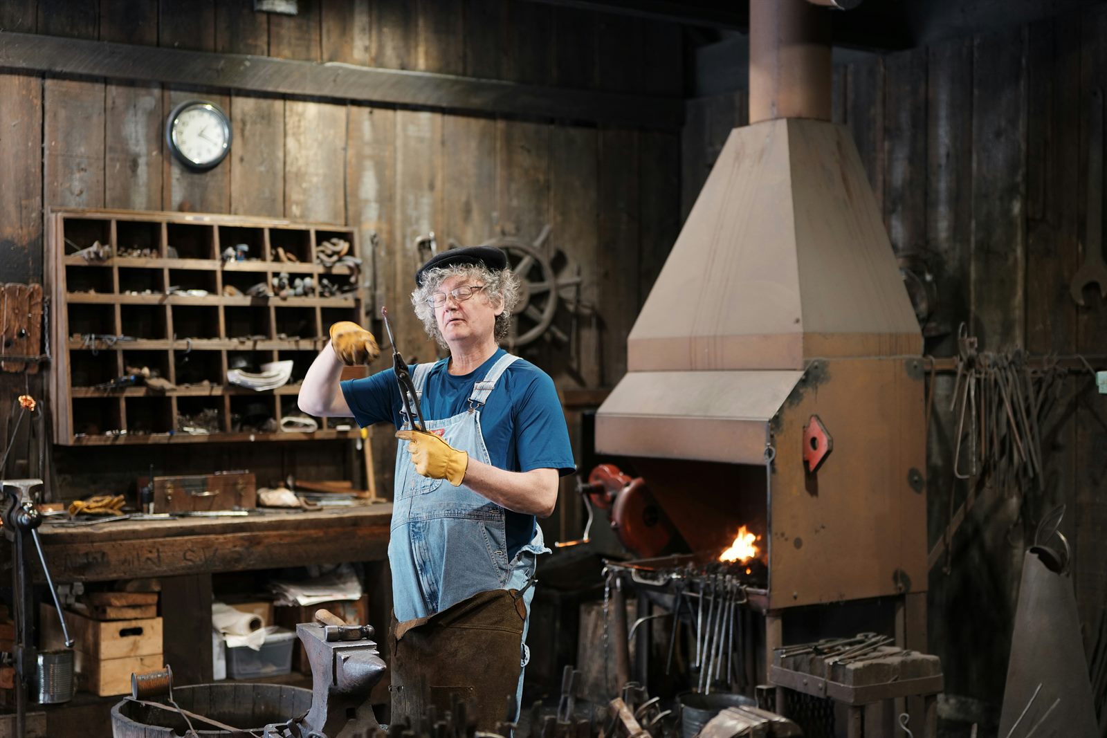 Group of people in a craft workshop learning woodworking together