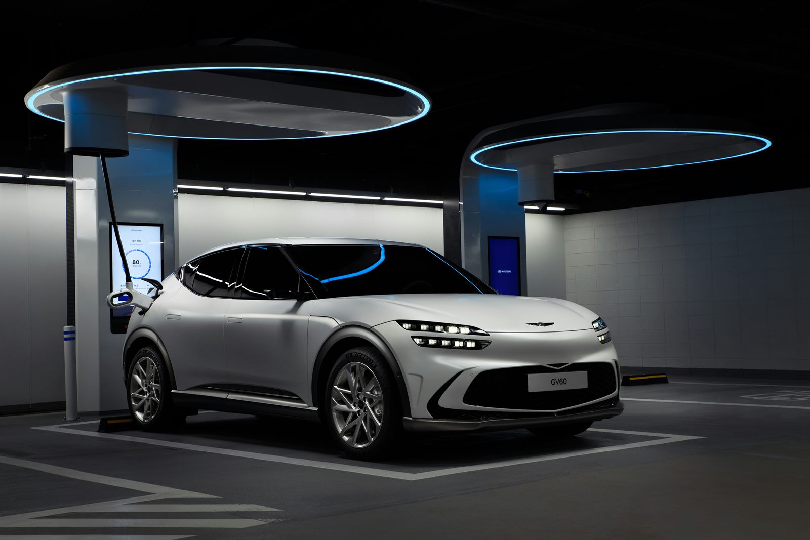 Electric car connected to an ultra-fast charging station with a display counting range added in seconds