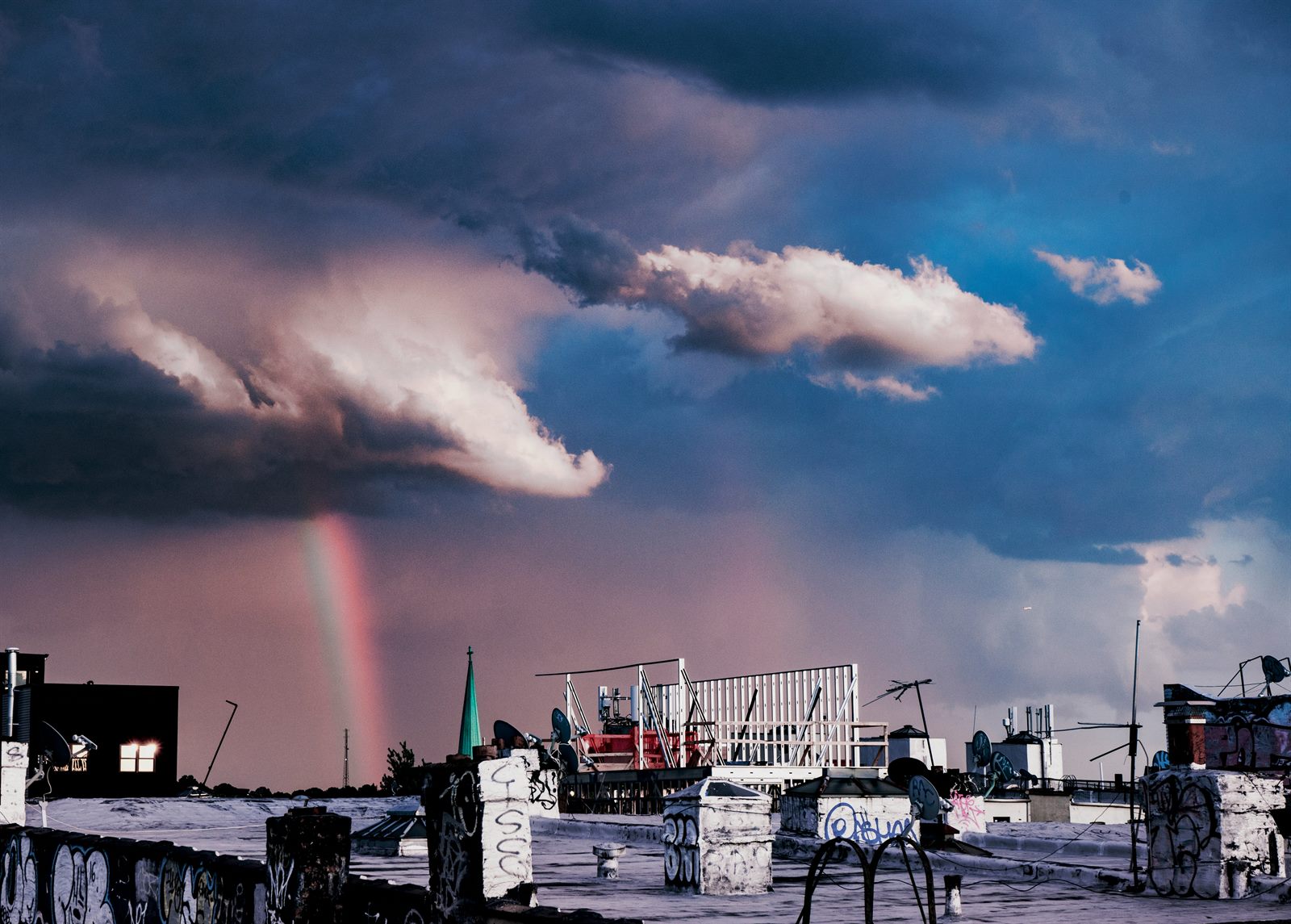 Diplomats studying an atmospheric moisture map of contested cross-border weather systems